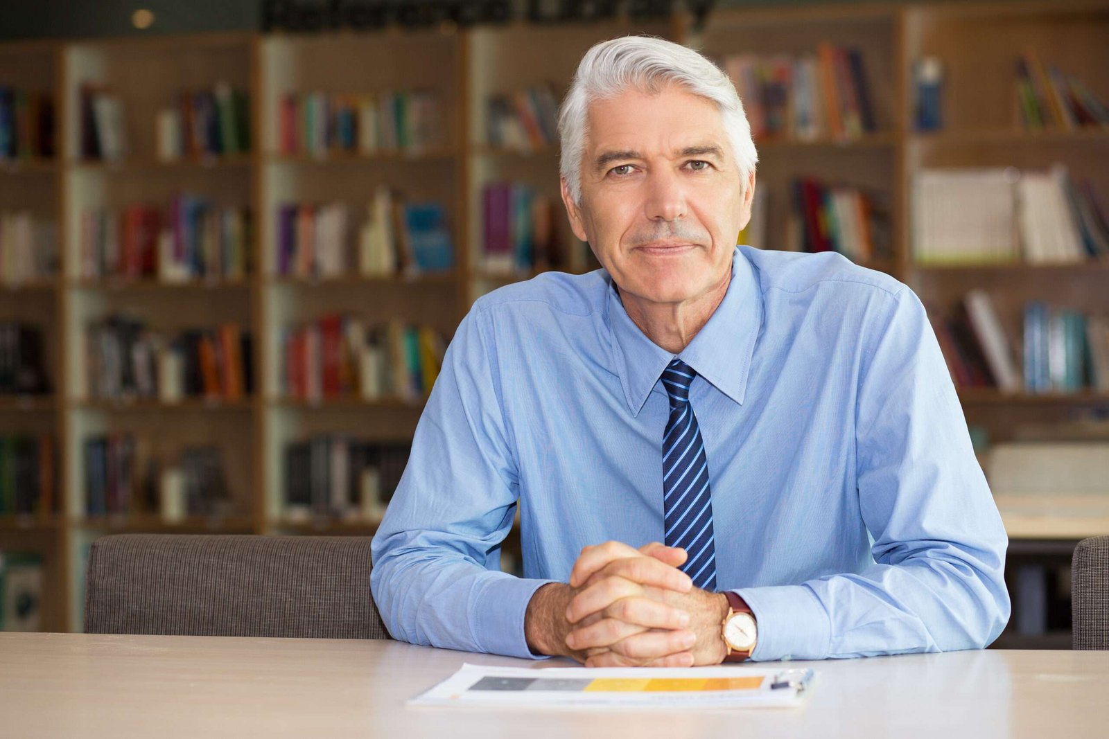 portrait confident senior businessman office scaled.jpg